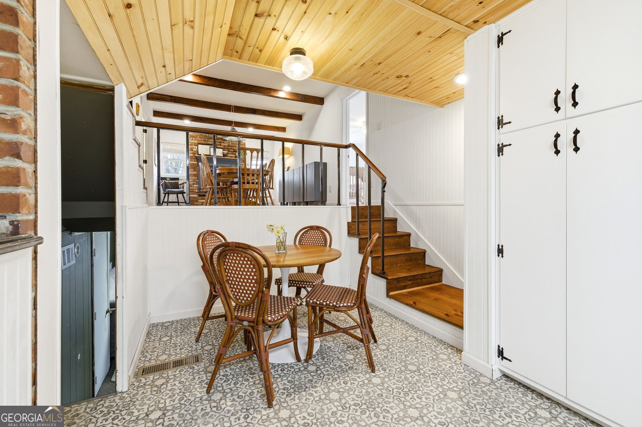 1879 Falls Road Toccoa, GA 30577 - Photo 15 of 36 a view of a hallway that has a dining table and chairs