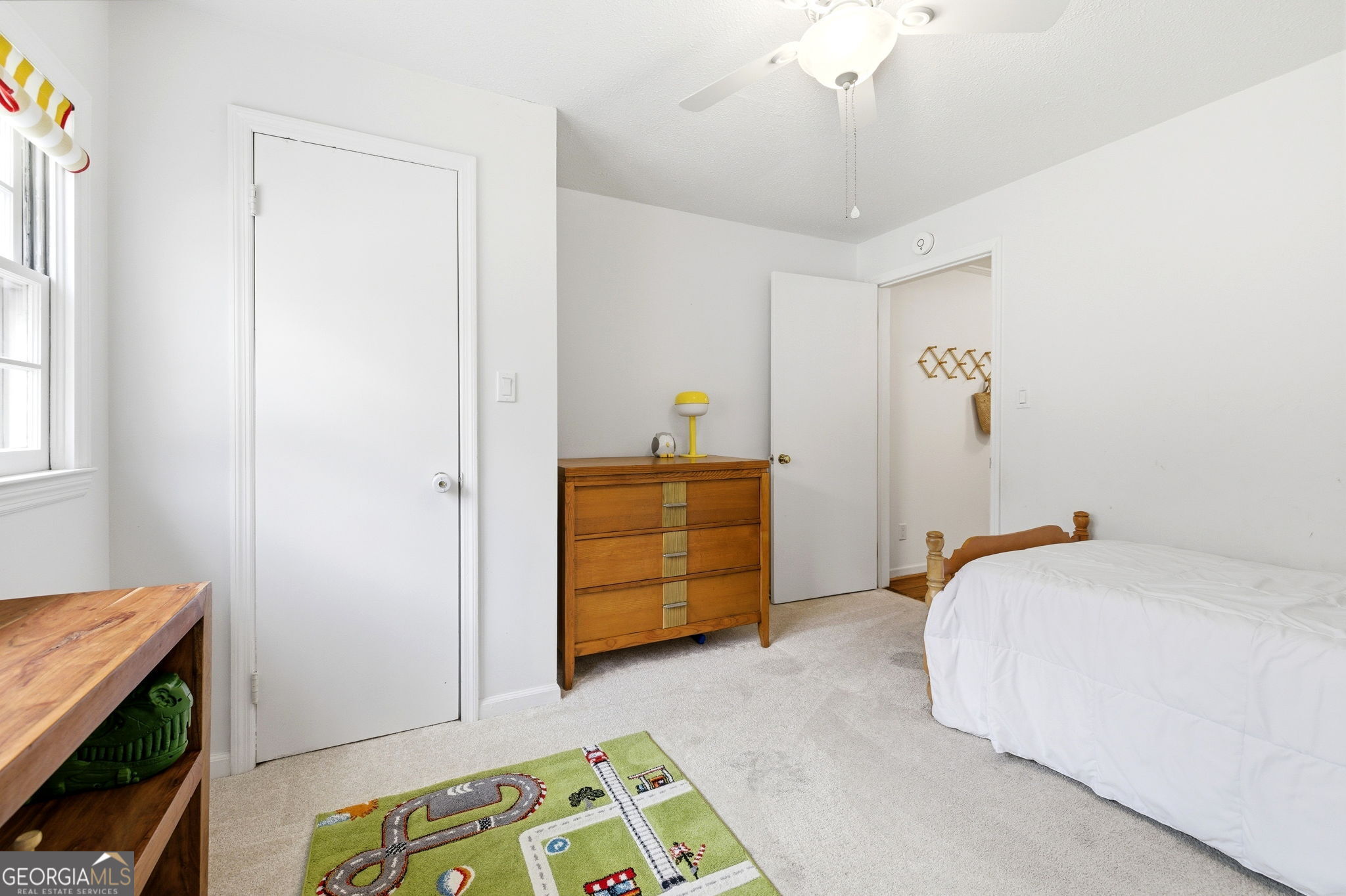 1879 Falls Road Toccoa, GA 30577 - Photo 17 of 36 a bedroom with a bed and furniture