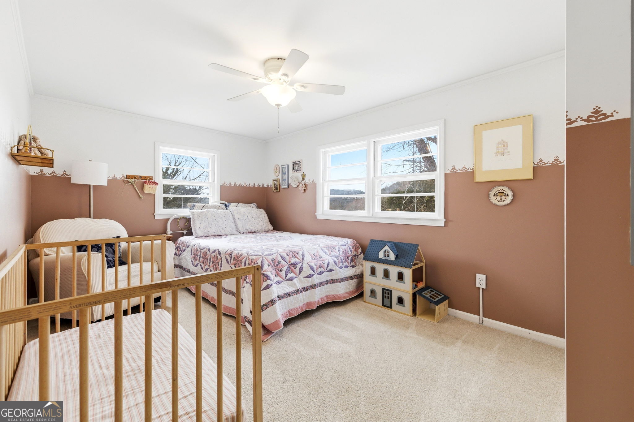 1879 Falls Road Toccoa, GA 30577 - Photo 19 of 36 a bedroom with a bed and a chandelier