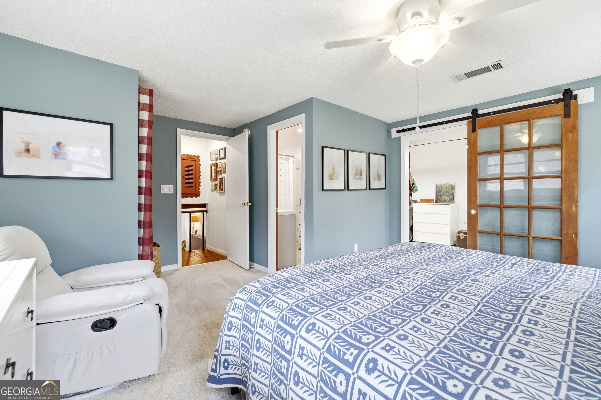 1879 Falls Road Toccoa, GA 30577 - Photo 24 of 36 a bedroom with a bed and a large window