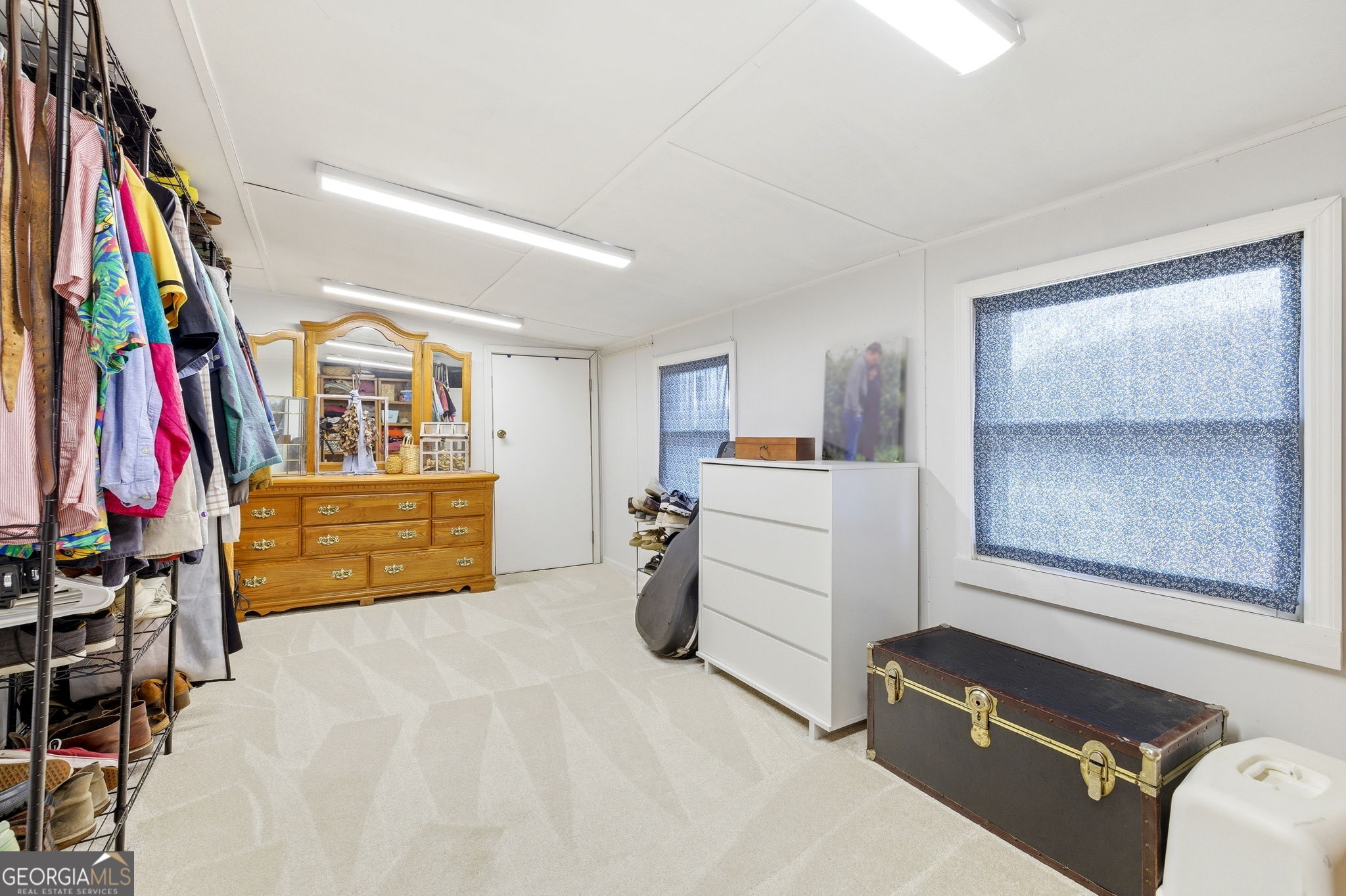 1879 Falls Road Toccoa, GA 30577 - Photo 25 of 36 a view of walk in closet with clothes and shoes