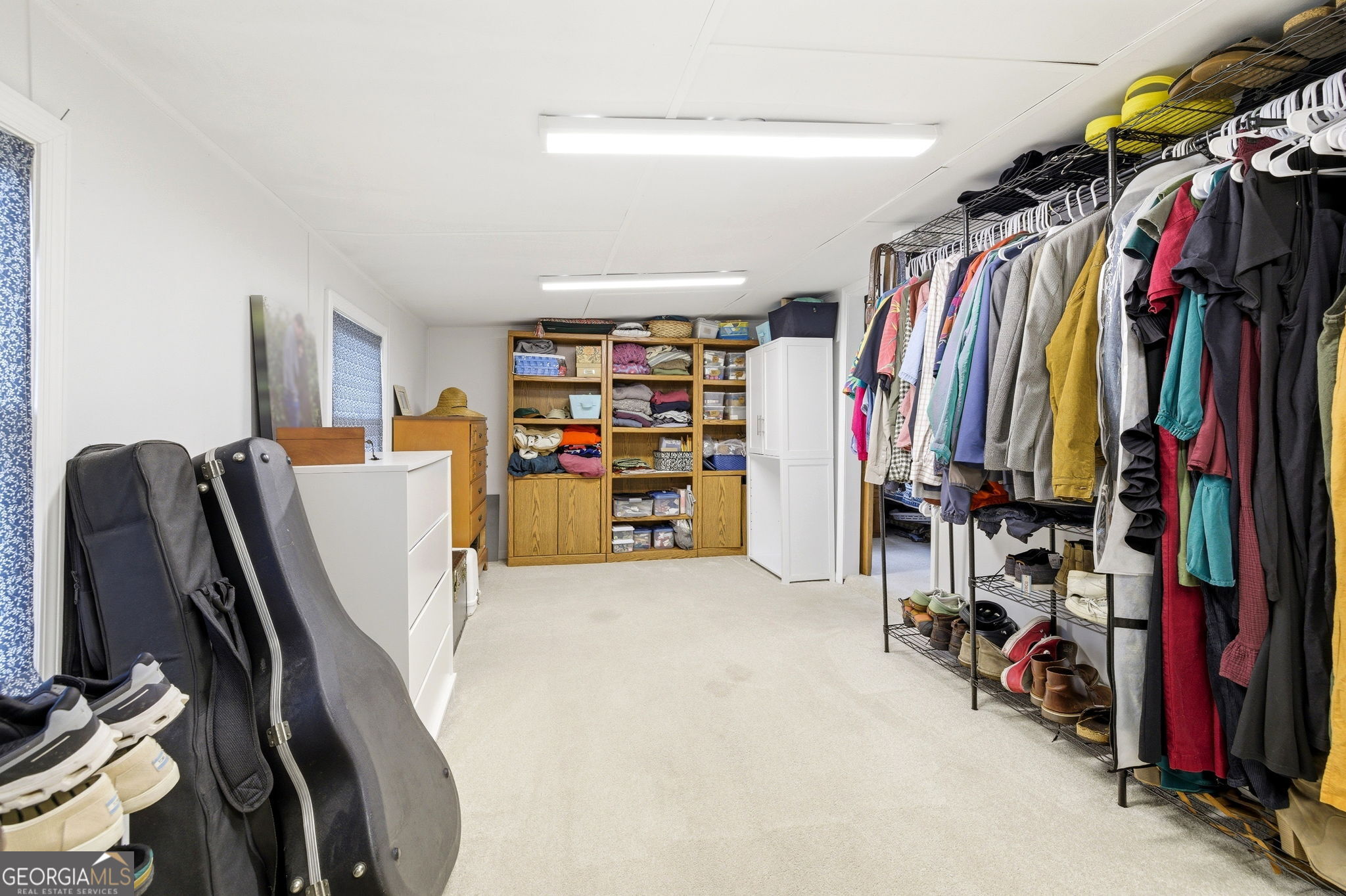 1879 Falls Road Toccoa, GA 30577 - Photo 26 of 36 a view of walk in closet with clothes and shoes