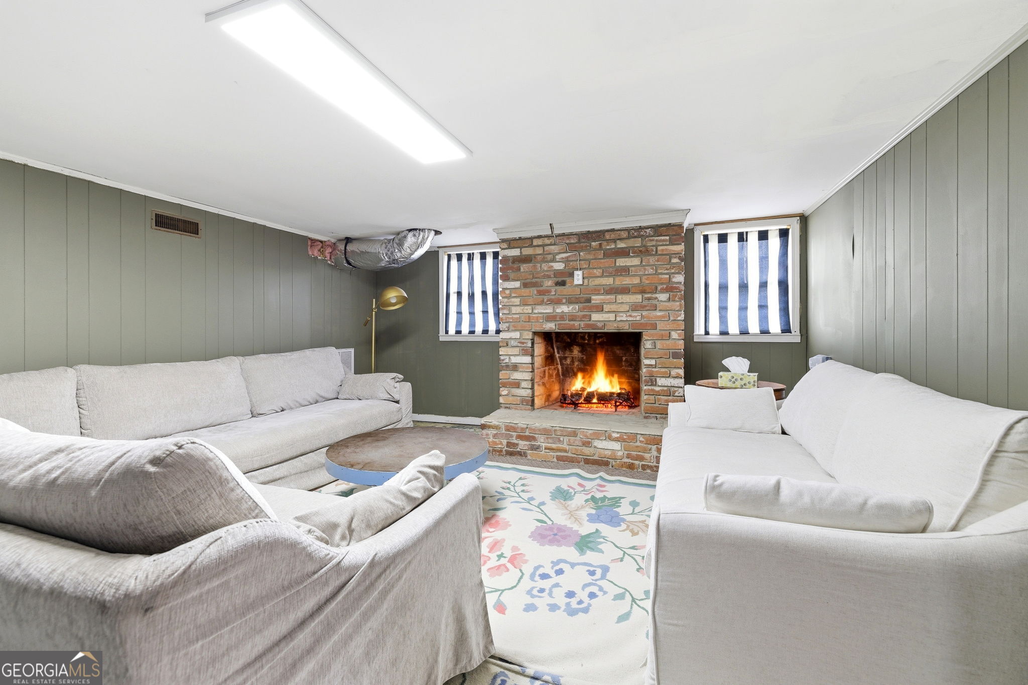 1879 Falls Road Toccoa, GA 30577 - Photo 29 of 36 a living room with furniture and a fireplace