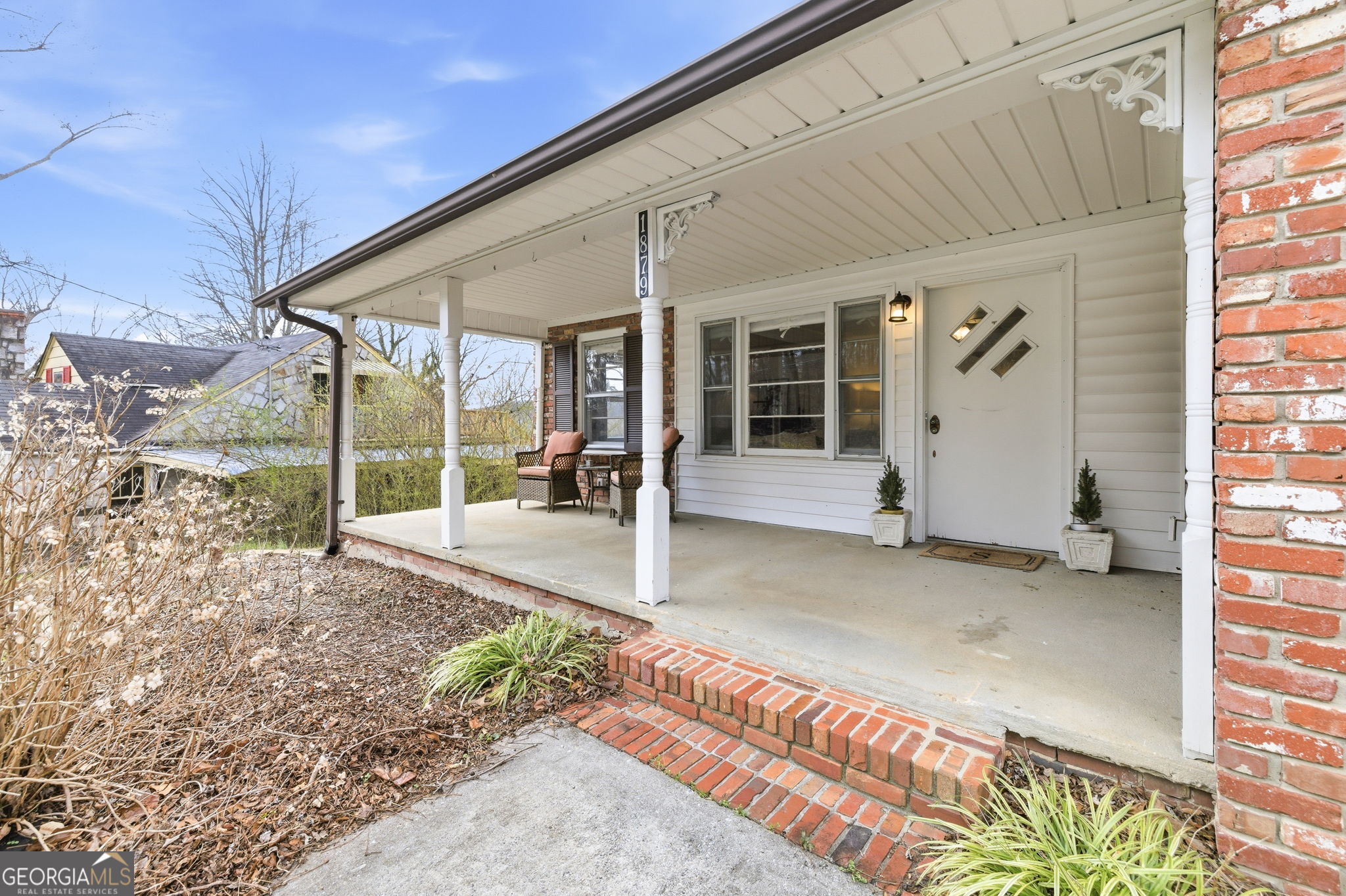 1879 Falls Road Toccoa, GA 30577 - Photo 3 of 36 a view of a patio with table and chairs under an umbrella