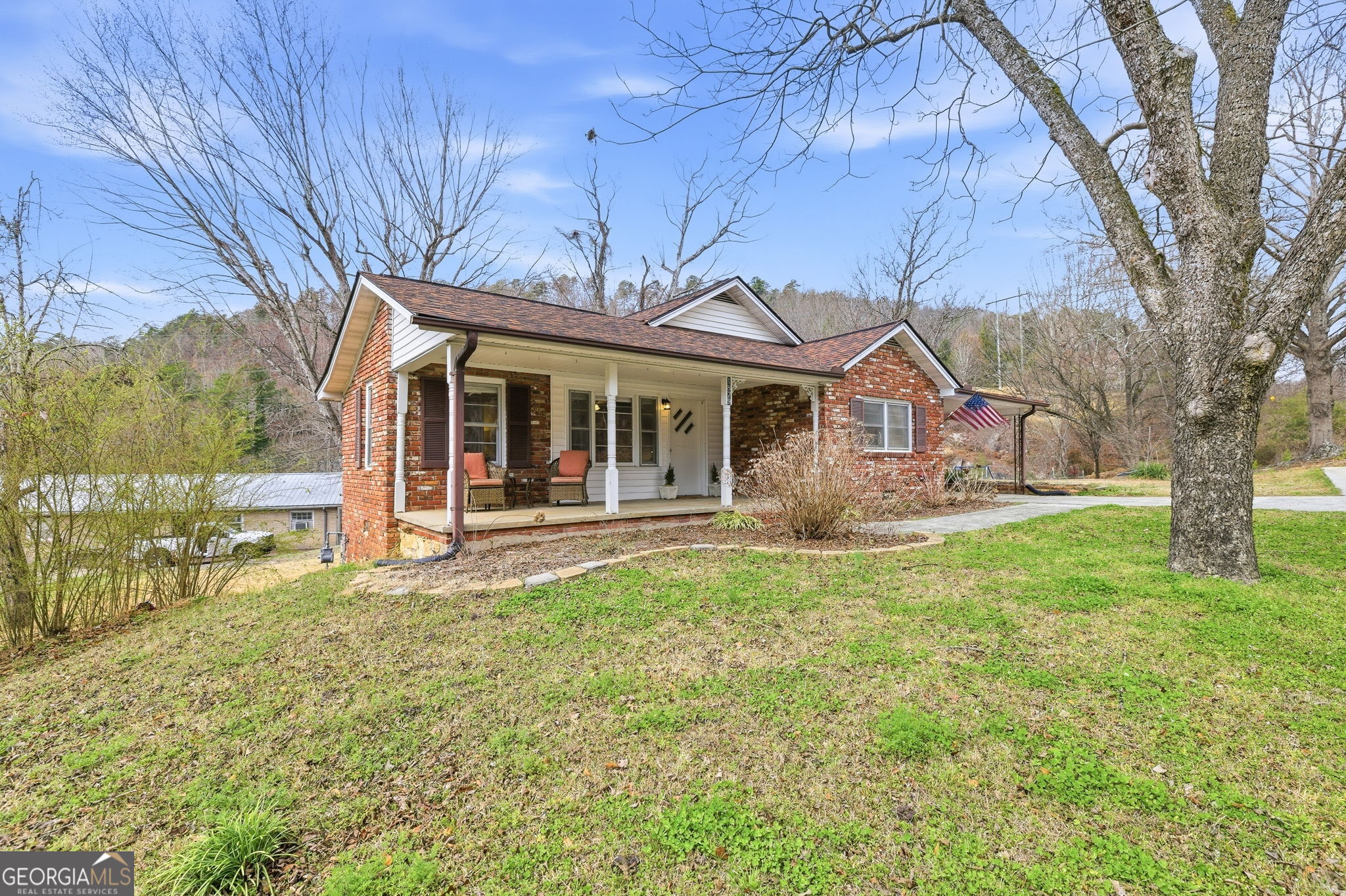 1879 Falls Road Toccoa, GA 30577 - Photo 36 of 36 a view of a house with backyard and a tree