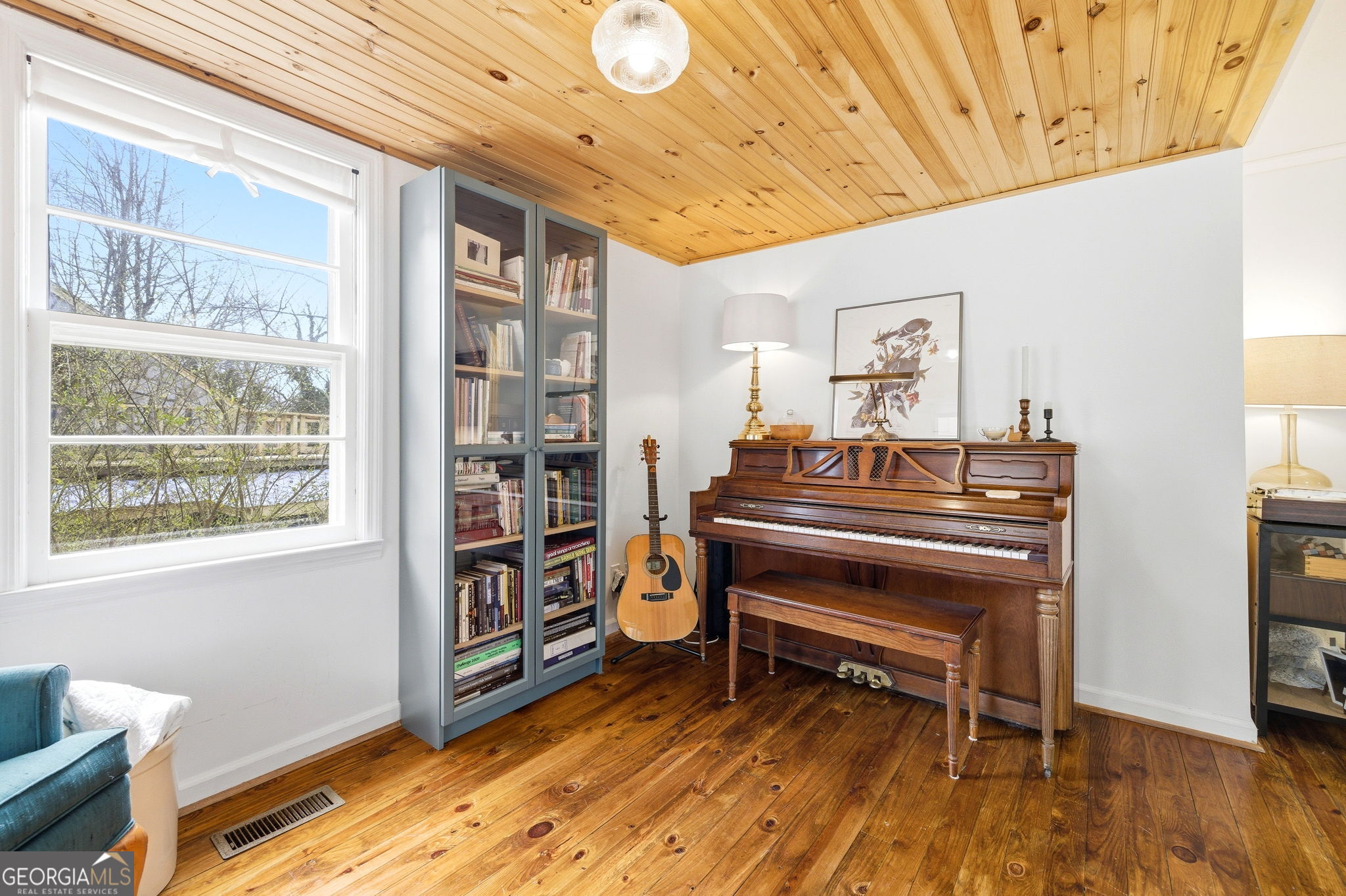 1879 Falls Road Toccoa, GA 30577 - Photo 8 of 36 a room with furniture and a bookshelf
