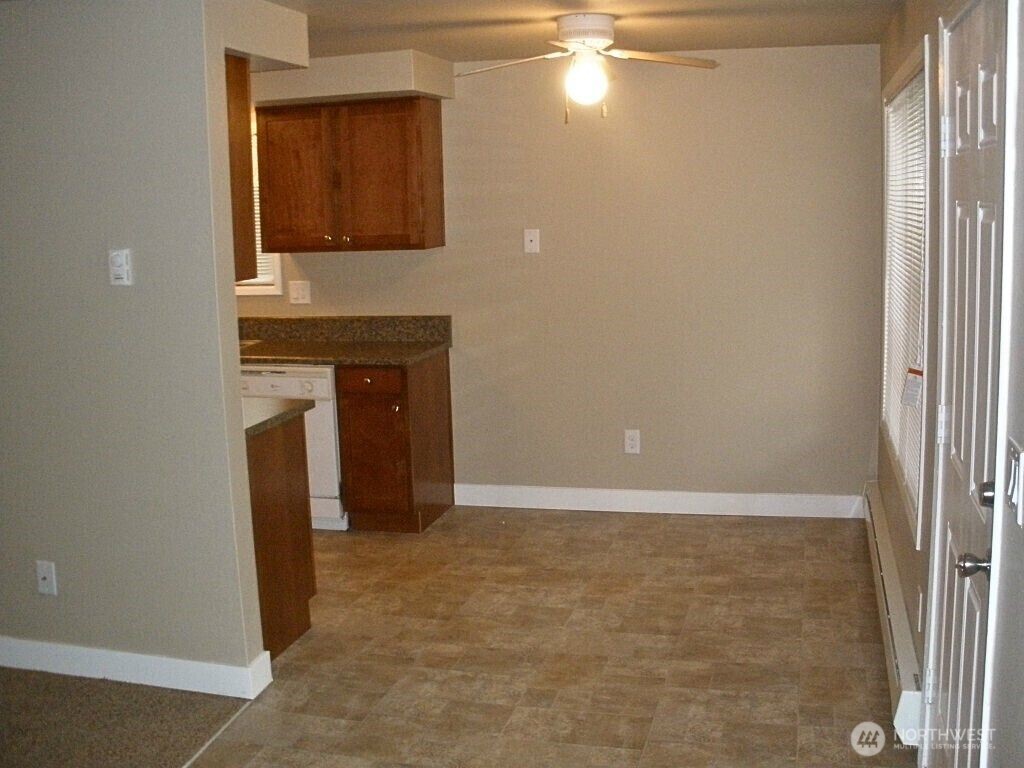 18332 Hurst Road Lynnwood, WA 98037 - Photo 7 of 9 a view of an empty room with window and fireplace