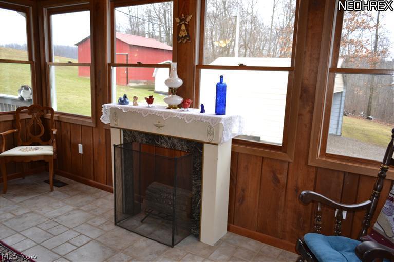 693 Beans Road Sherrodsville, OH 44675 - Photo 8 of 22 Fireplace in the Sunroom