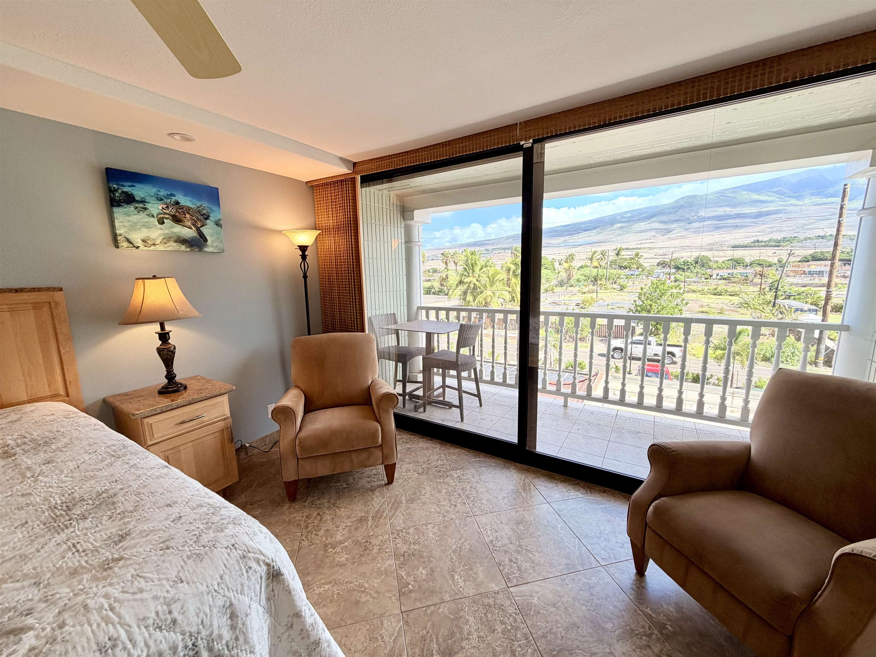 475 Front Street, Unit 320 Lahaina, HI 96761 - Photo 16 of 41 a bedroom with furniture and large windows