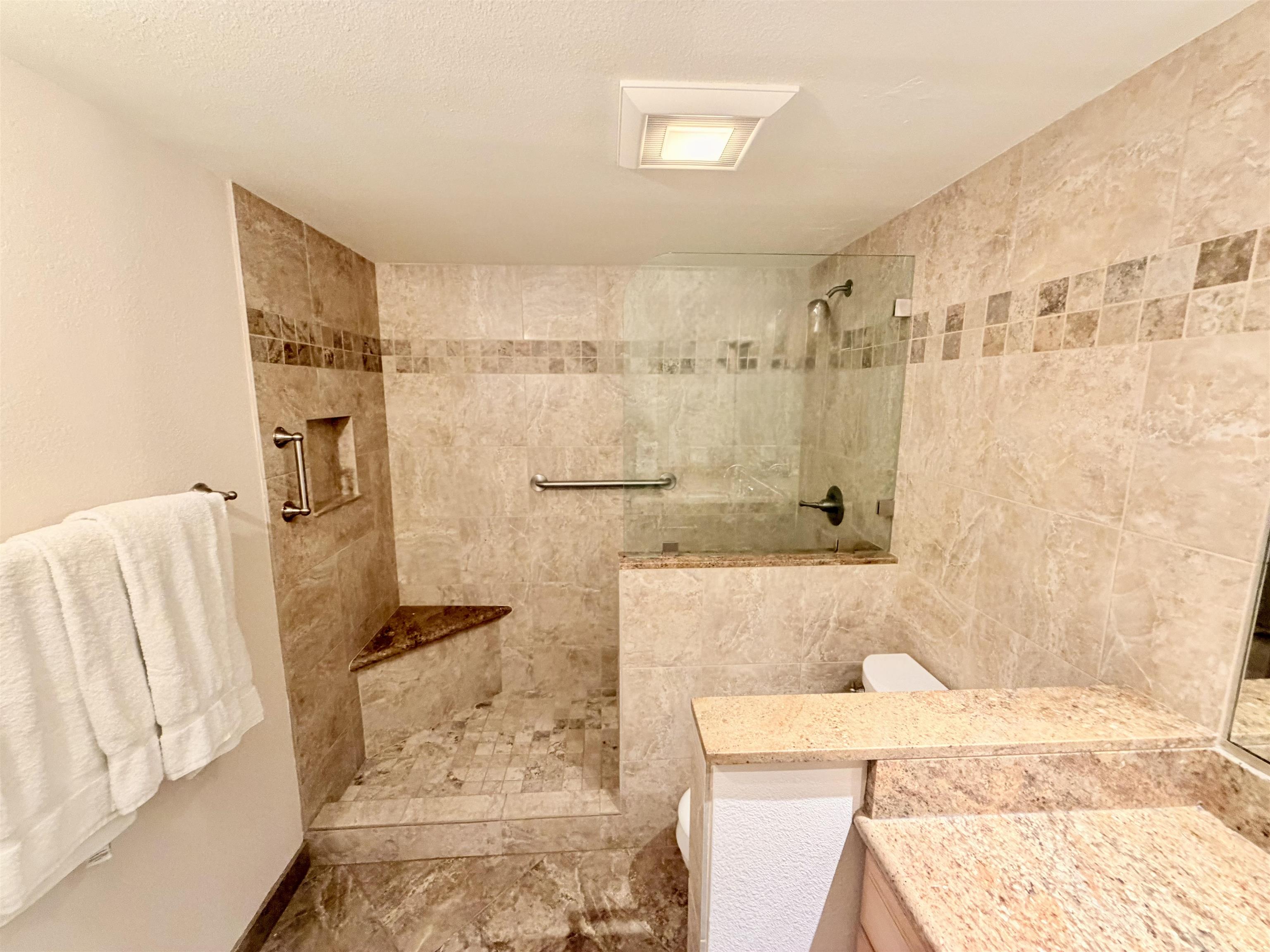 475 Front Street, Unit 320 Lahaina, HI 96761 - Photo 20 of 41 a bathroom with a bathtub and shower