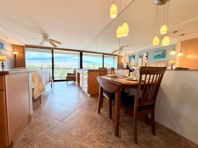 a view of a dining room with furniture window and outside view