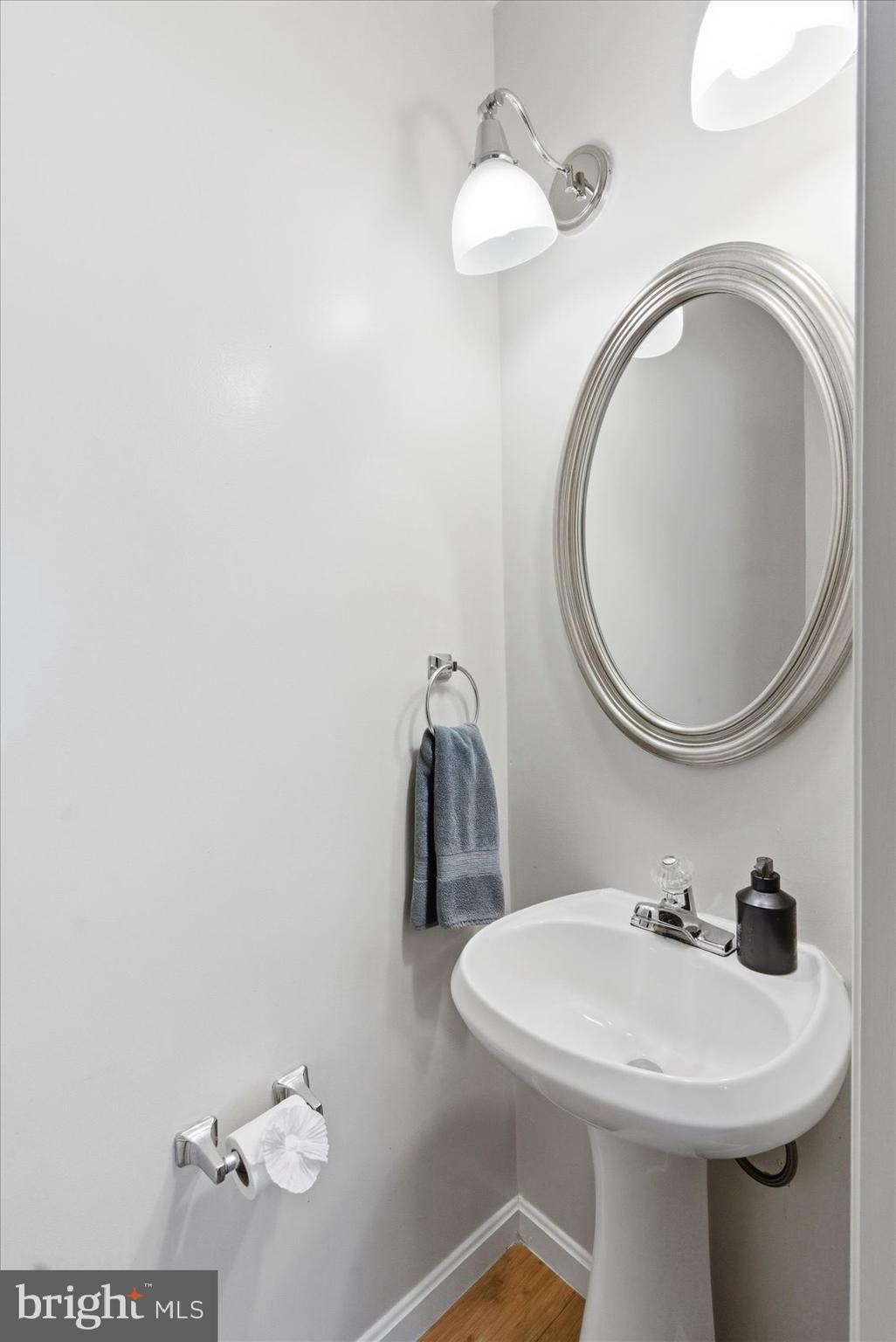 1408 Webster Street Baltimore, MD 21230 - Photo 12 of 30 a bathroom with a sink a mirror and vanity