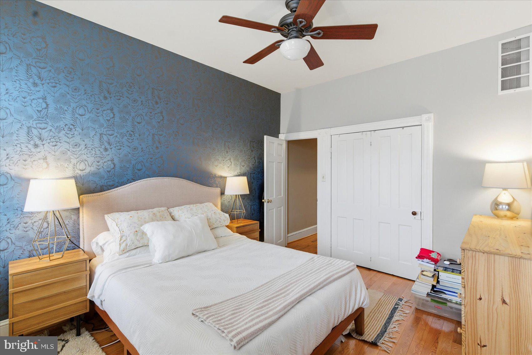 1408 Webster Street Baltimore, MD 21230 - Photo 14 of 30 a bedroom with a bed and a chandelier