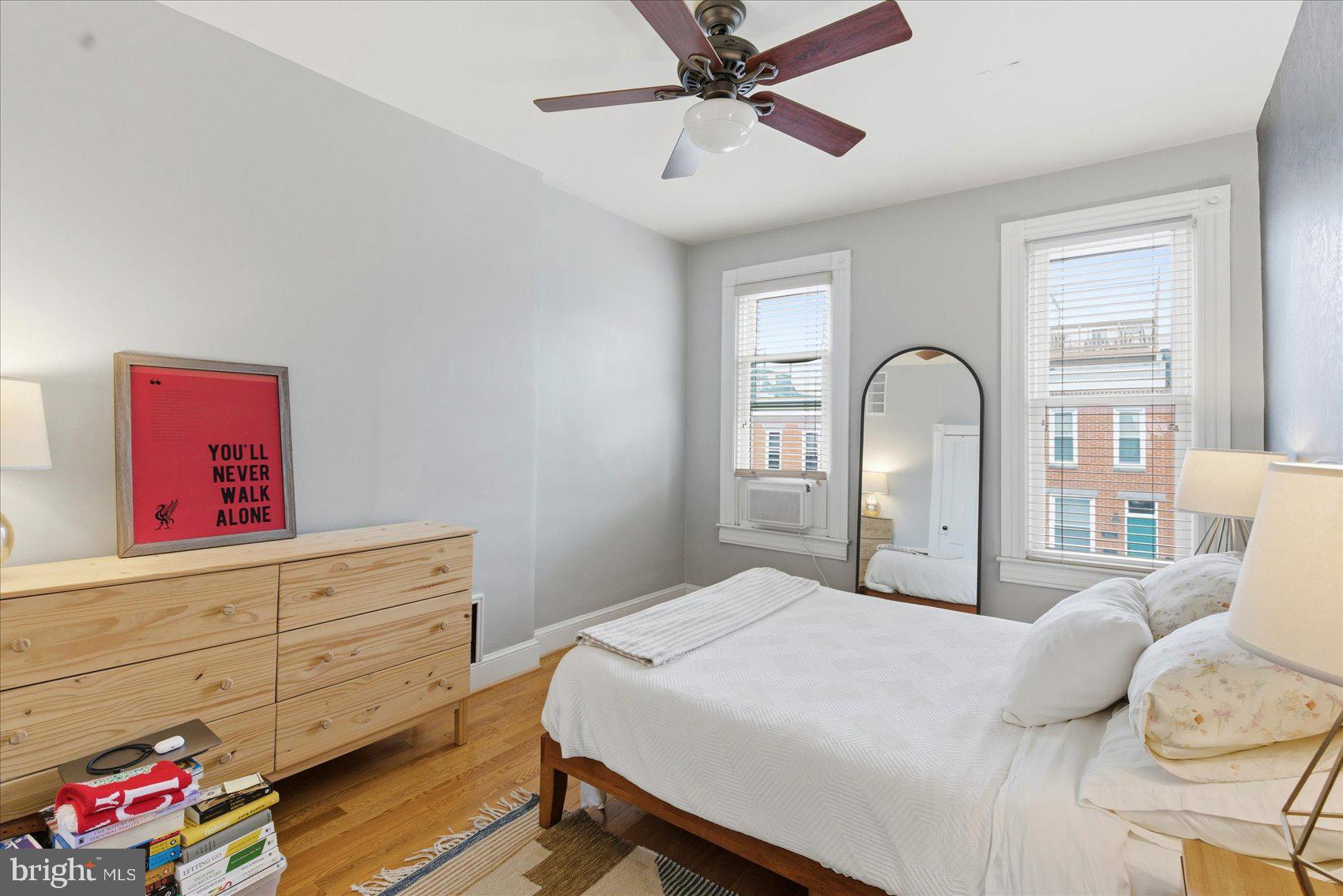 1408 Webster Street Baltimore, MD 21230 - Photo 16 of 30 a bedroom with a bed and a dresser