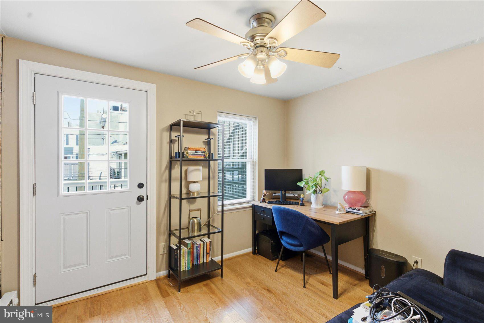 1408 Webster Street Baltimore, MD 21230 - Photo 17 of 30 a view of a workspace with furniture and a window