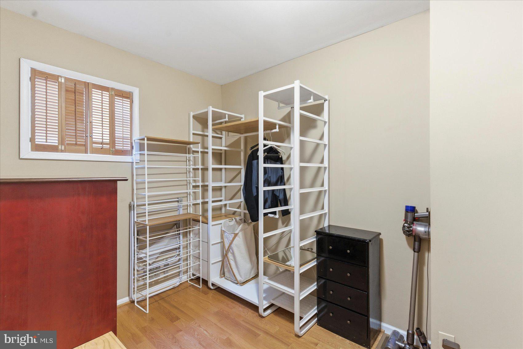 1408 Webster Street Baltimore, MD 21230 - Photo 19 of 30 a view of a room with walk in closet and wooden floor