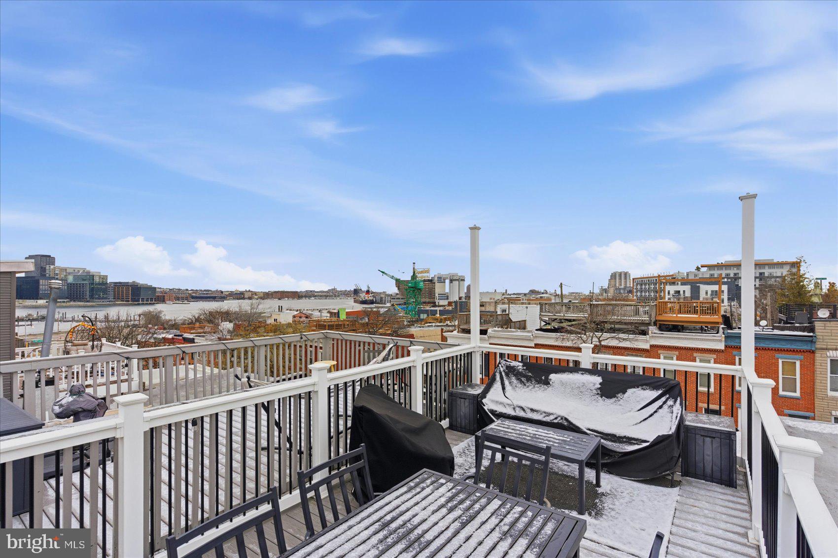1408 Webster Street Baltimore, MD 21230 - Photo 24 of 30 a view of a terrace with wooden benches