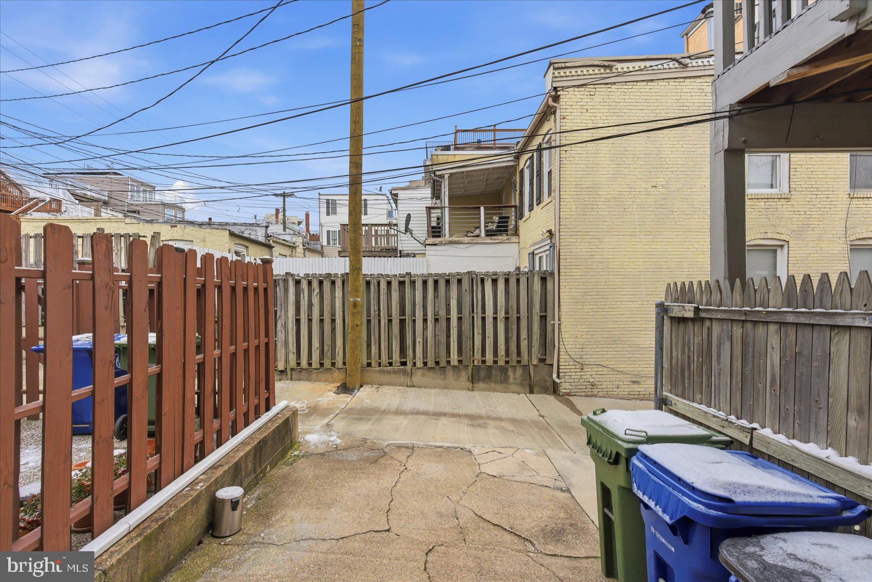 1408 Webster Street Baltimore, MD 21230 - Photo 28 of 30 a view of a backyard with wooden fence