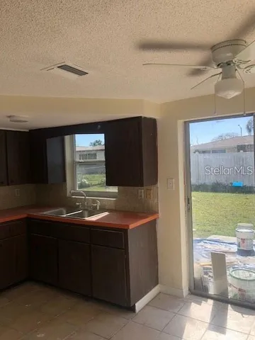 a kitchen with a sink and a stove