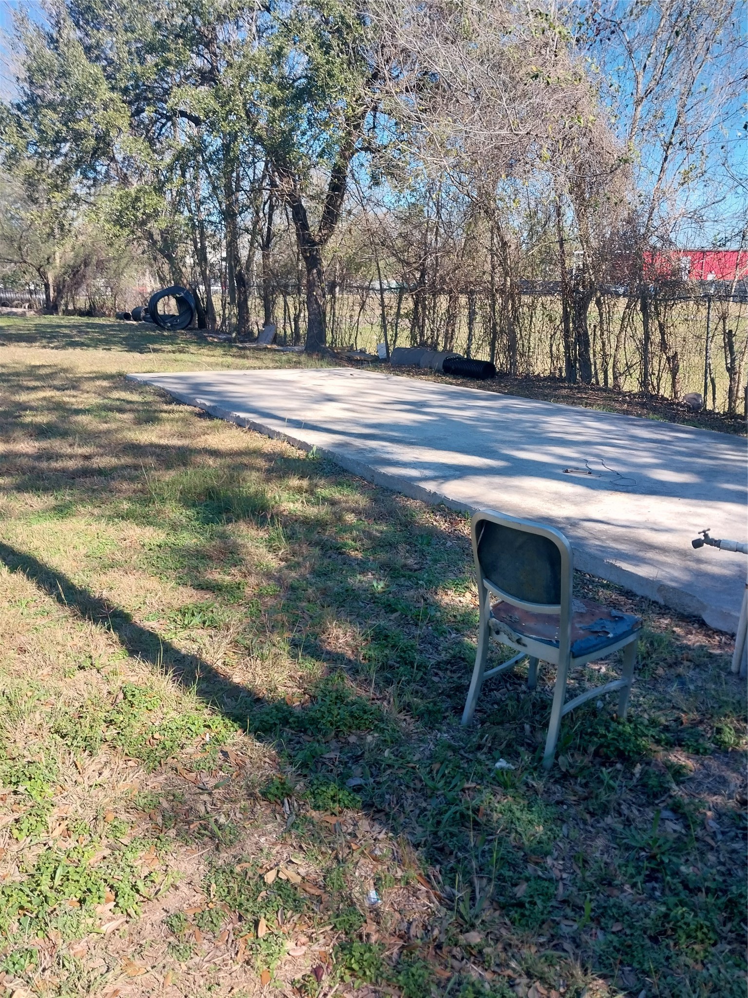 15153 Waterloo Drive Houston, TX 77053 - Photo 4 of 4 a backyard of a house with table and chairs