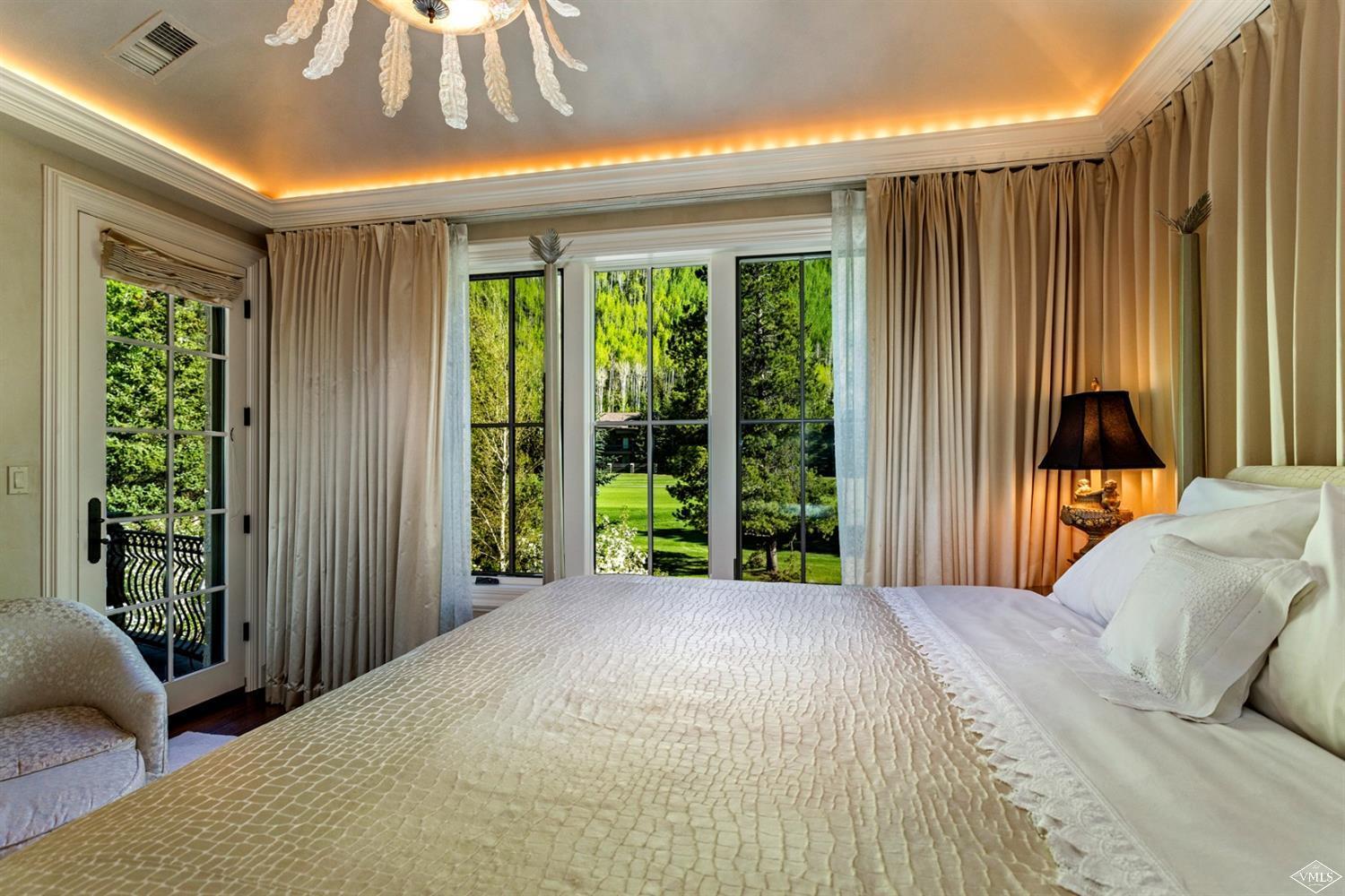 1109 Vail Valley Drive Vail, CO 81657 - Photo 11 of 25 a bedroom with a bed and a window