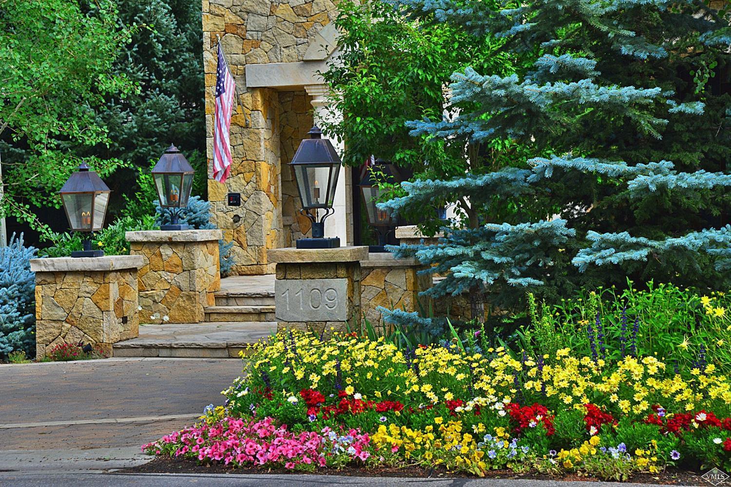 1109 Vail Valley Drive Vail, CO 81657 - Photo 3 of 25 a front view of a house with a yard