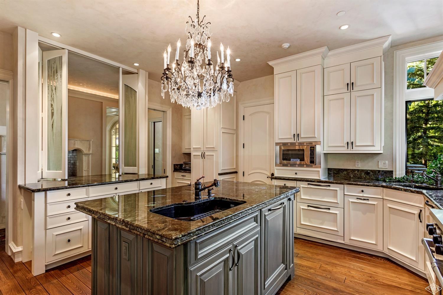 1109 Vail Valley Drive Vail, CO 81657 - Photo 5 of 25 a kitchen with stainless steel appliances granite countertop a sink and cabinets