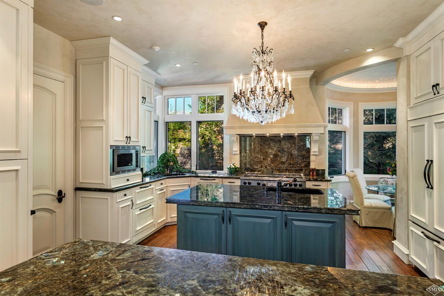 1109 Vail Valley Drive Vail, CO 81657 - Photo 6 of 25 a kitchen with stainless steel appliances granite countertop a sink stove and refrigerator