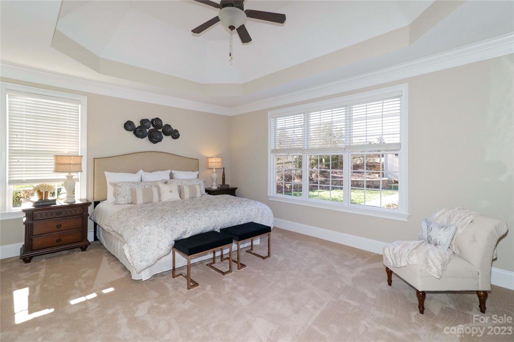 120 Sink Farm Road Mooresville, NC 28115 - Photo 26 of 46 a spacious bedroom with a bed and a couch