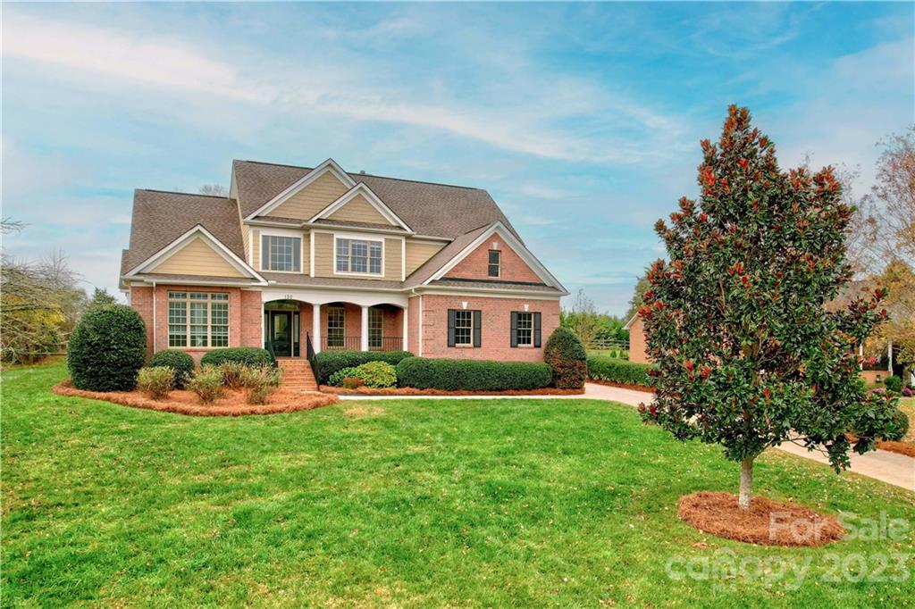 120 Sink Farm Road Mooresville, NC 28115 - Photo 3 of 46 a front view of a house with a yard table and chairs