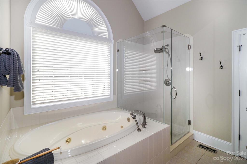 120 Sink Farm Road Mooresville, NC 28115 - Photo 31 of 46 a bathroom with a tub a sink and a window