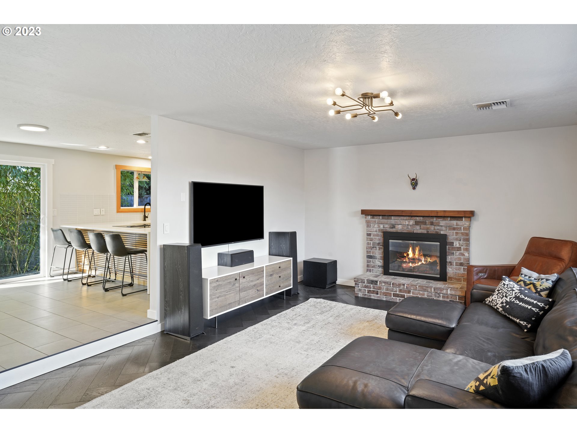 2180 9th Street Springfield, OR 97477 - Photo 3 of 32 a living room with furniture and a flat screen tv