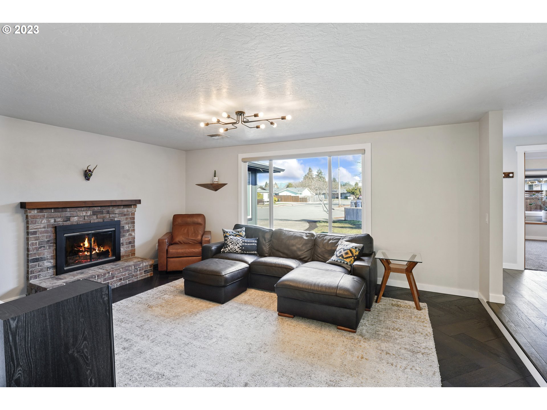 2180 9th Street Springfield, OR 97477 - Photo 4 of 32 a living room with furniture and a fireplace