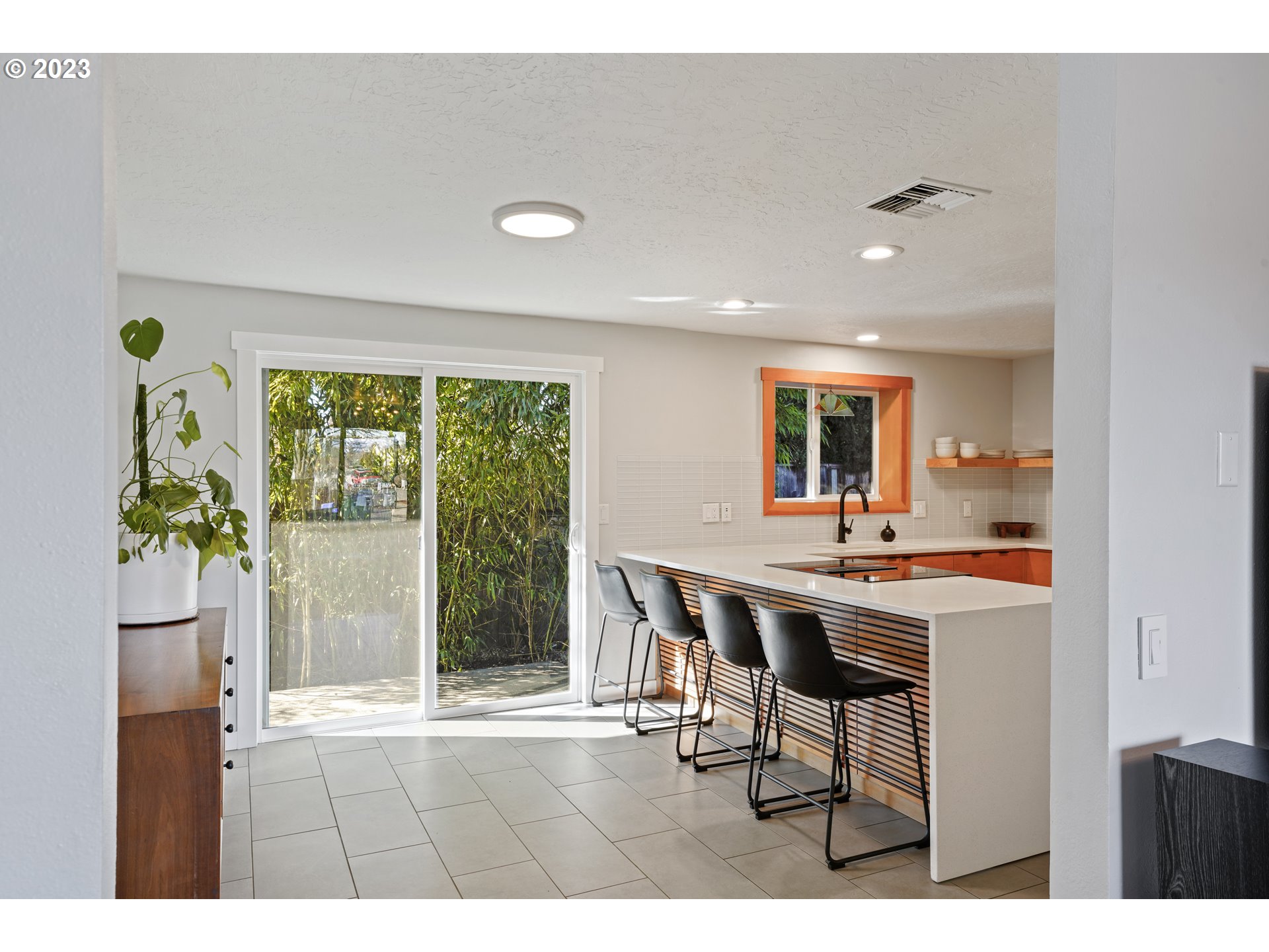 2180 9th Street Springfield, OR 97477 - Photo 5 of 32 a open kitchen with a table and chairs
