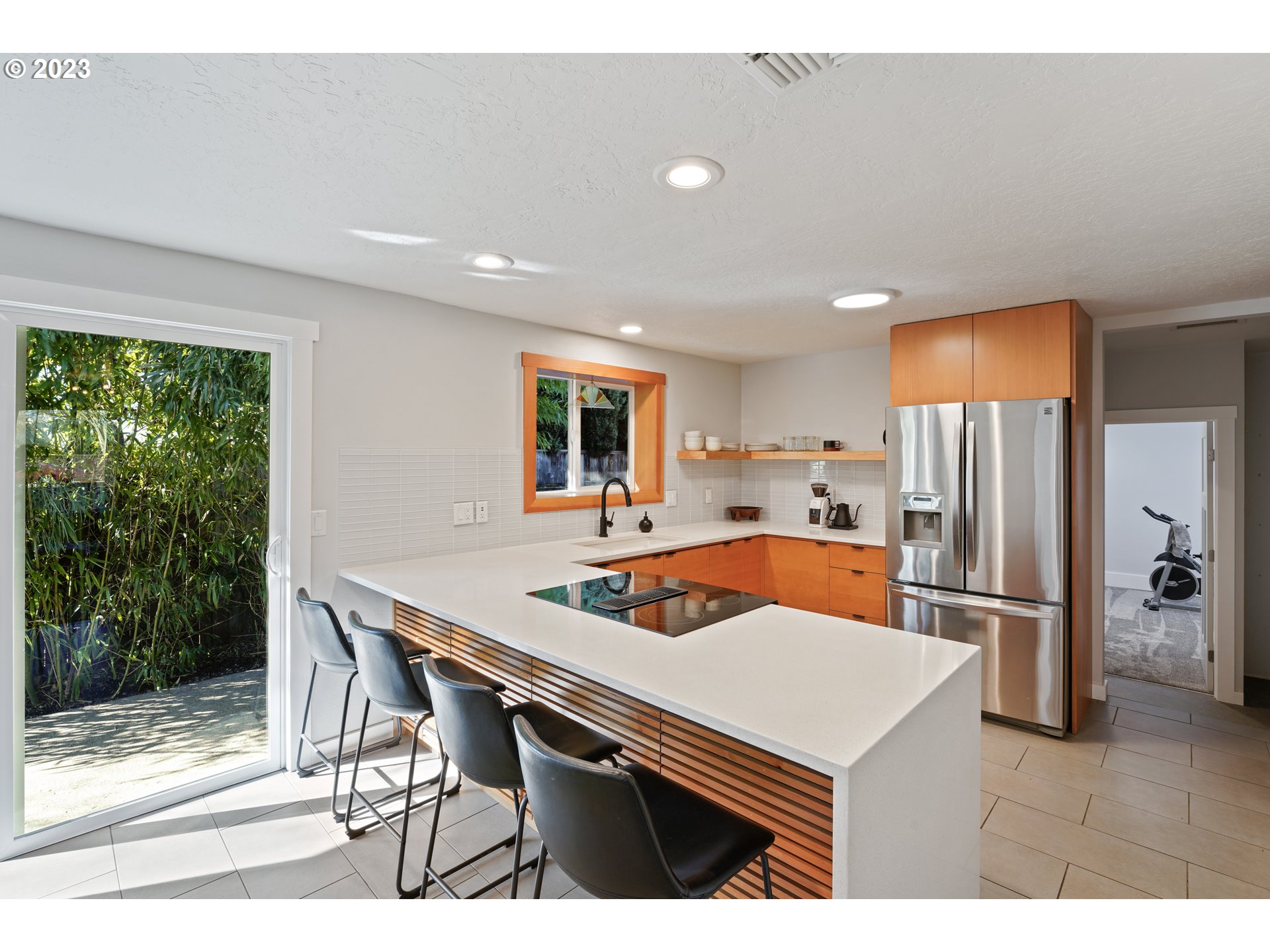 2180 9th Street Springfield, OR 97477 - Photo 6 of 32 a kitchen with a table chairs refrigerator and cabinets
