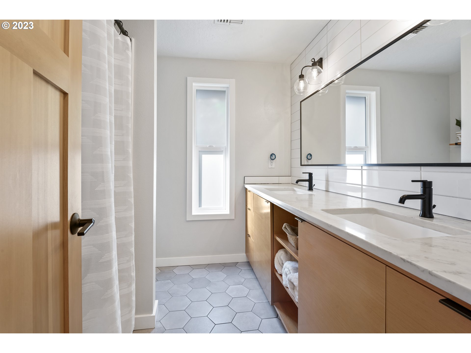 2180 9th Street Springfield, OR 97477 - Photo 10 of 32 a kitchen with a sink cabinets and a window
