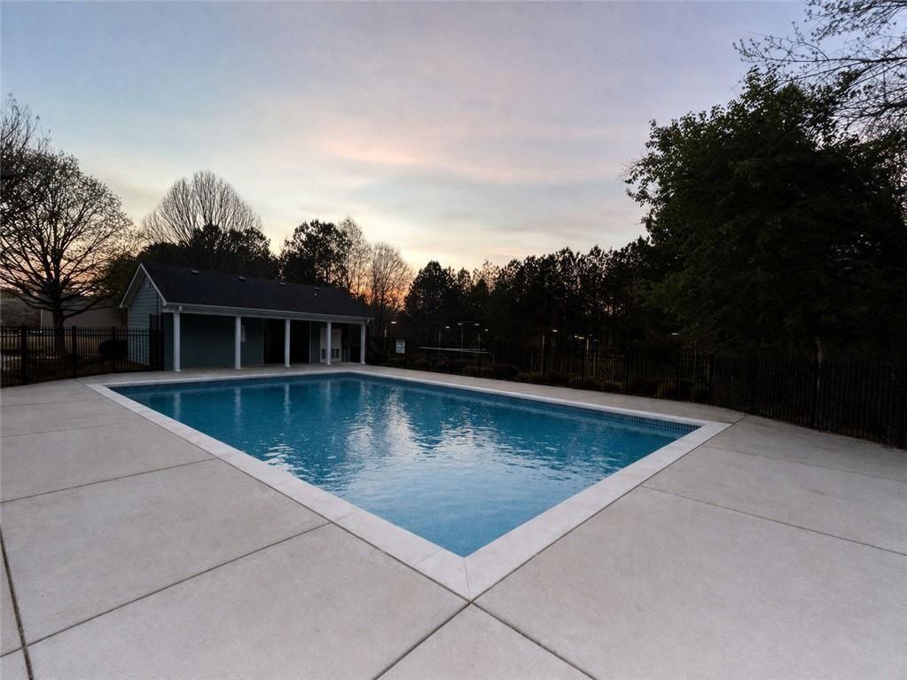 1516 Parc Main Street Lawrenceville, GA 30046 - Photo 15 of 16 a view of a swimming pool with a yard
