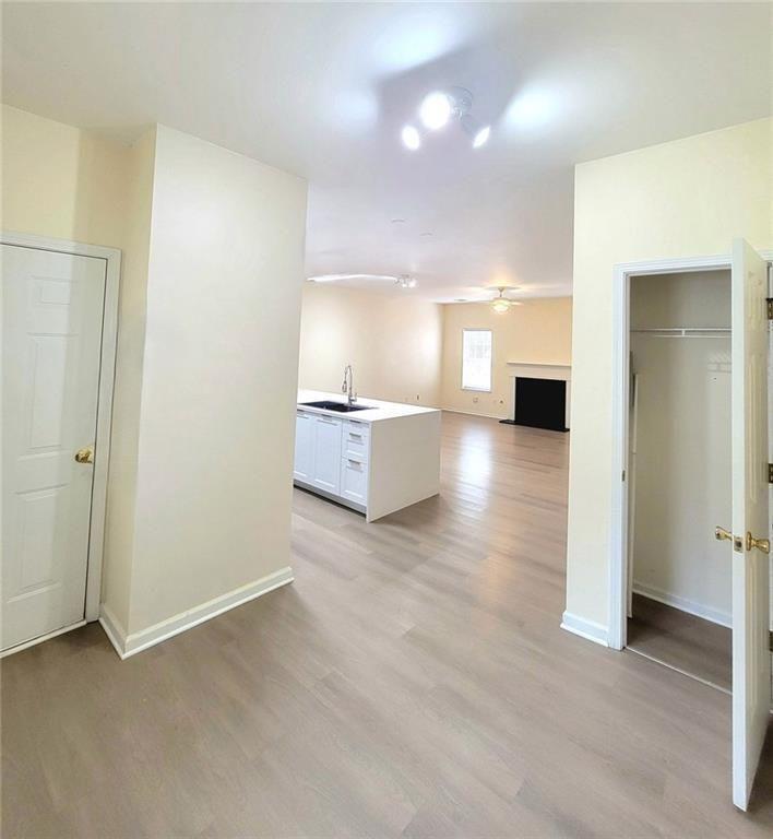 1516 Parc Main Street Lawrenceville, GA 30046 - Photo 3 of 16 an empty room with wooden floor and windows