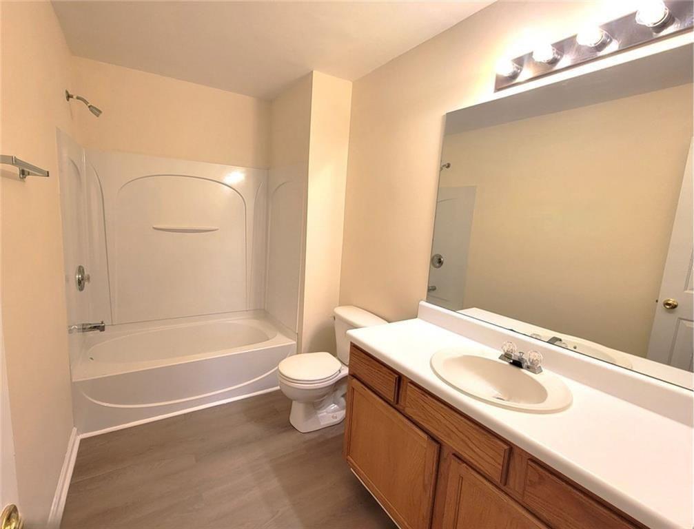 1516 Parc Main Street Lawrenceville, GA 30046 - Photo 8 of 16 a bathroom with a sink and a mirror