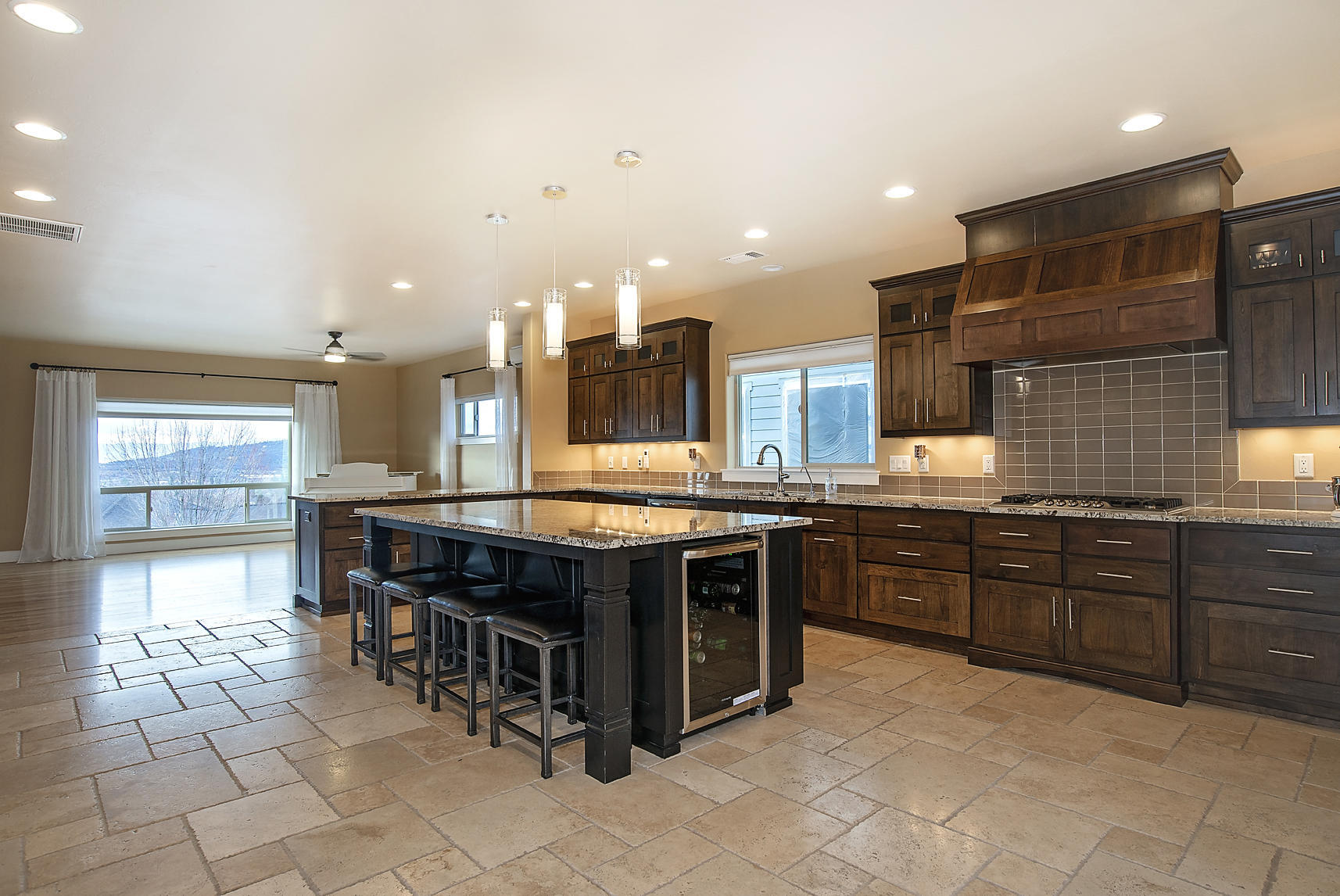 1360 Poppy Ridge Drive Eagle Point, OR 97524 - Photo 4 of 34 a large kitchen with a large counter top and stainless steel appliances