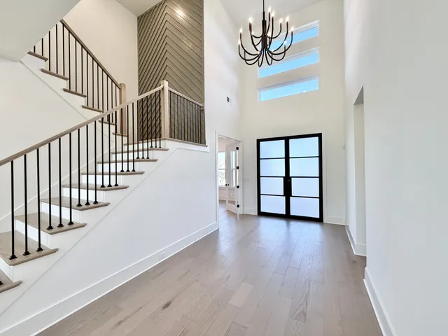 a view of an entryway with wooden floor