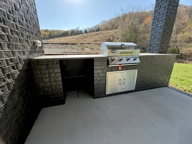 an empty room with a window and a ceiling fan