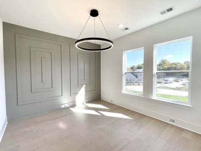 a living room with furniture a rug and a large window