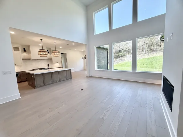 a kitchen with stainless steel appliances granite countertop a stove and a refrigerator