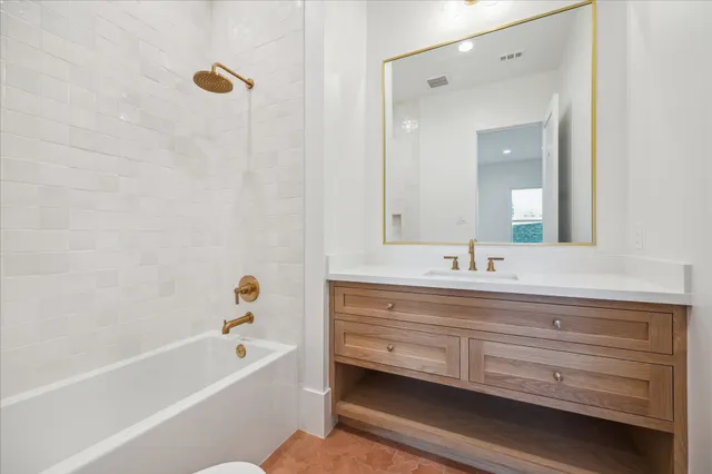 a bathroom with a bathtub and a sink