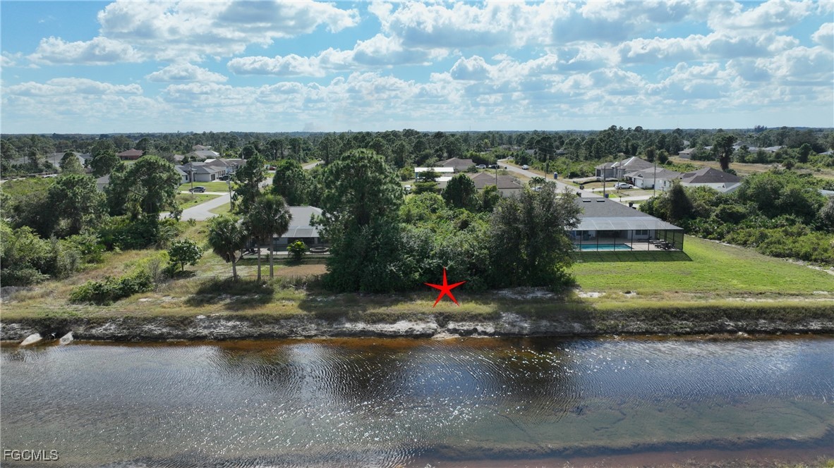 105 Paddock Street Lehigh Acres, FL 33974 - Photo 2 of 20 a view of a water fountain and a floor to ceiling window