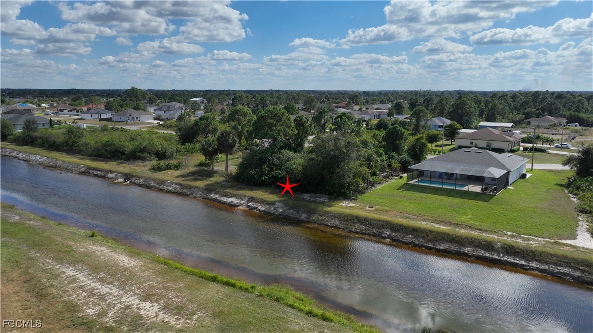 105 Paddock Street Lehigh Acres, FL 33974 - Photo 4 of 20 an aerial view of a houses with a street