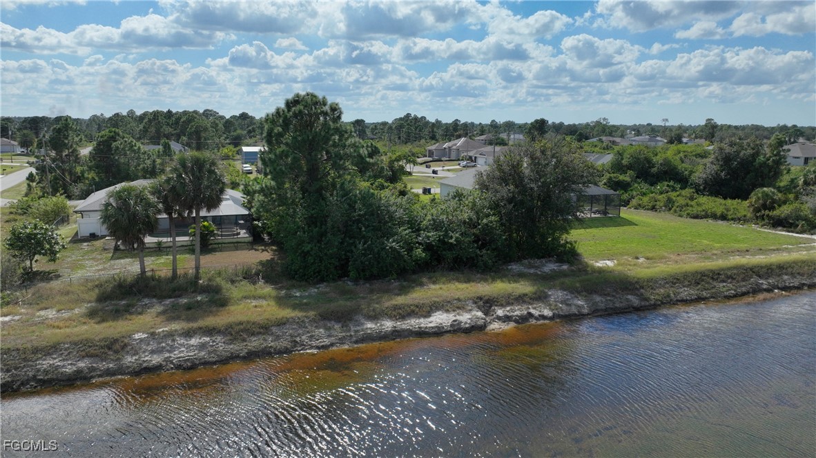 105 Paddock Street Lehigh Acres, FL 33974 - Photo 7 of 20 an aerial view of a houses with outdoor space