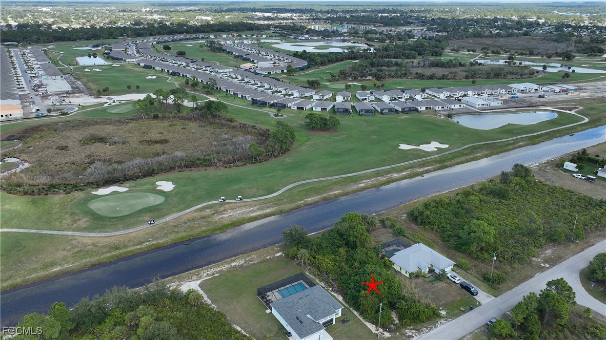 105 Paddock Street Lehigh Acres, FL 33974 - Photo 9 of 20 an aerial view of a city