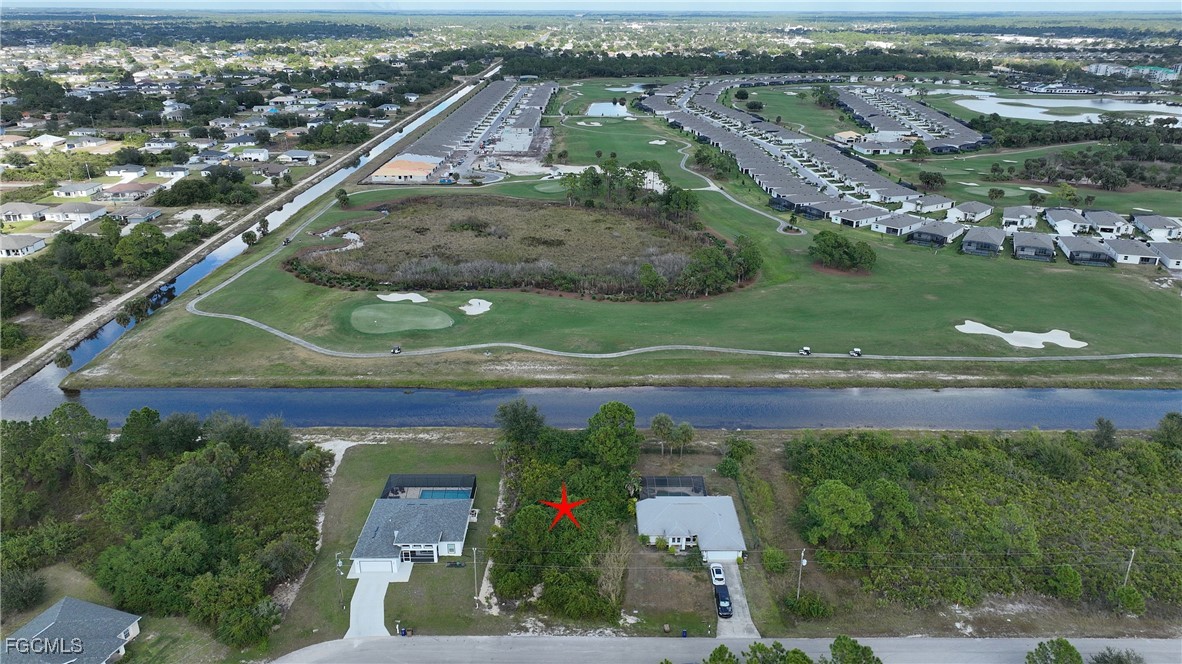 105 Paddock Street Lehigh Acres, FL 33974 - Photo 10 of 20 an aerial view of a house
